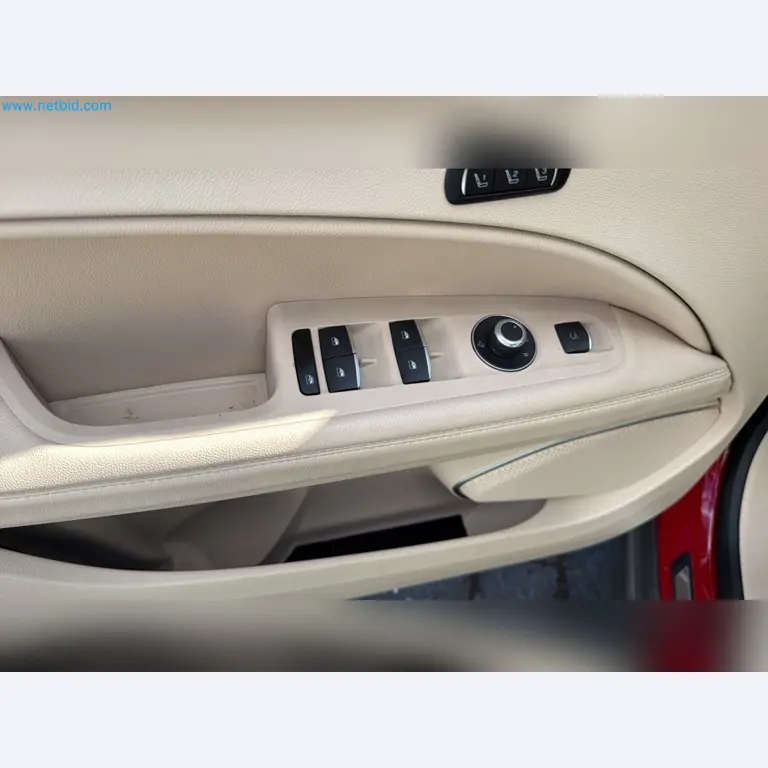 Passenger cars, electric cars, and automotive repair shop equipment at a Fiat dealership-13