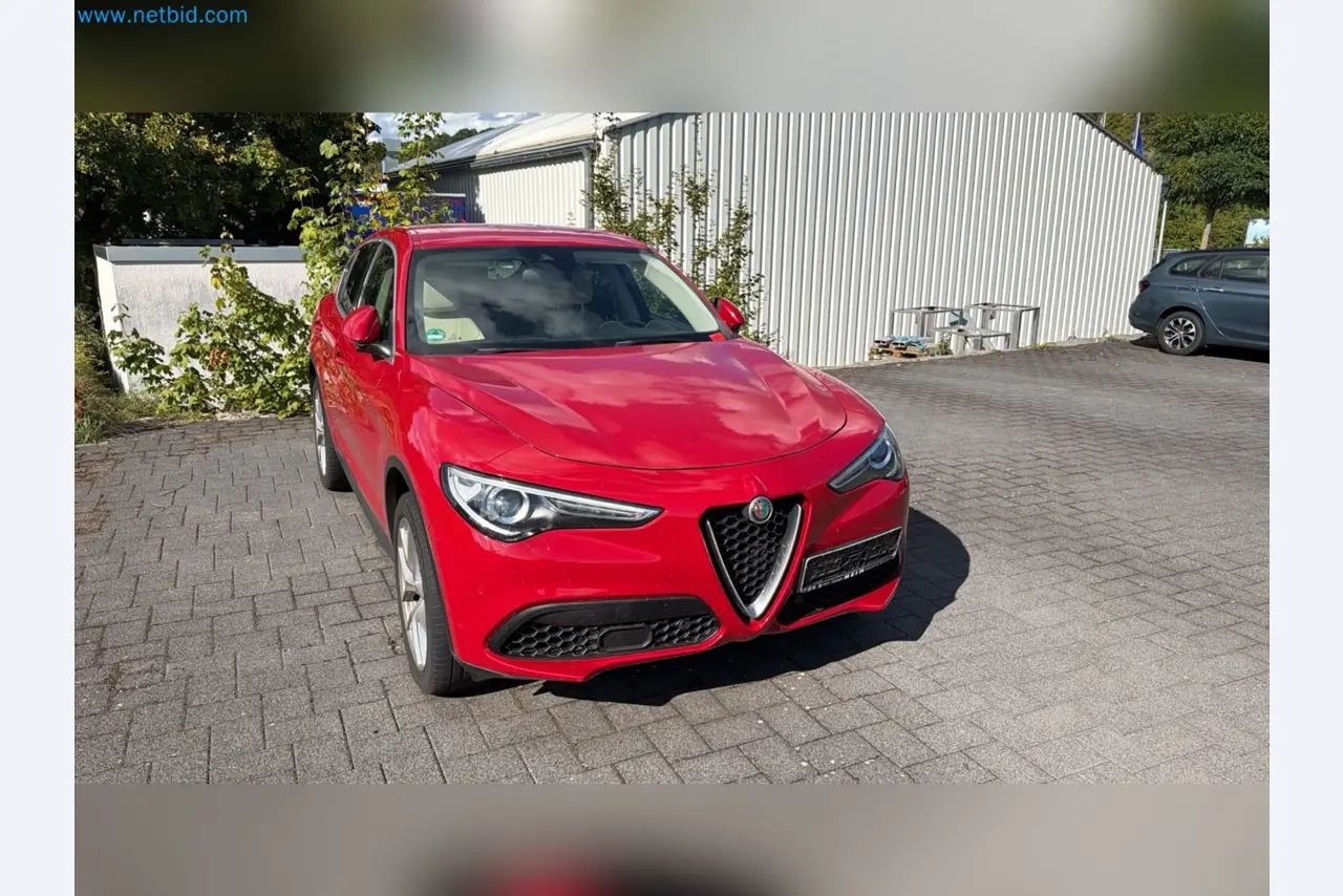 Passenger cars, electric cars, and automotive repair shop equipment at a Fiat dealership-1