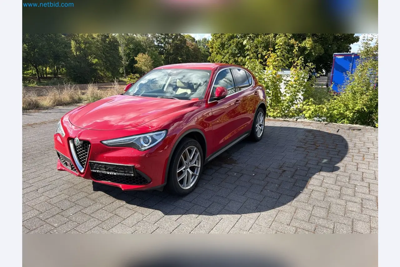 Passenger cars, electric cars, and automotive repair shop equipment at a Fiat dealership-2