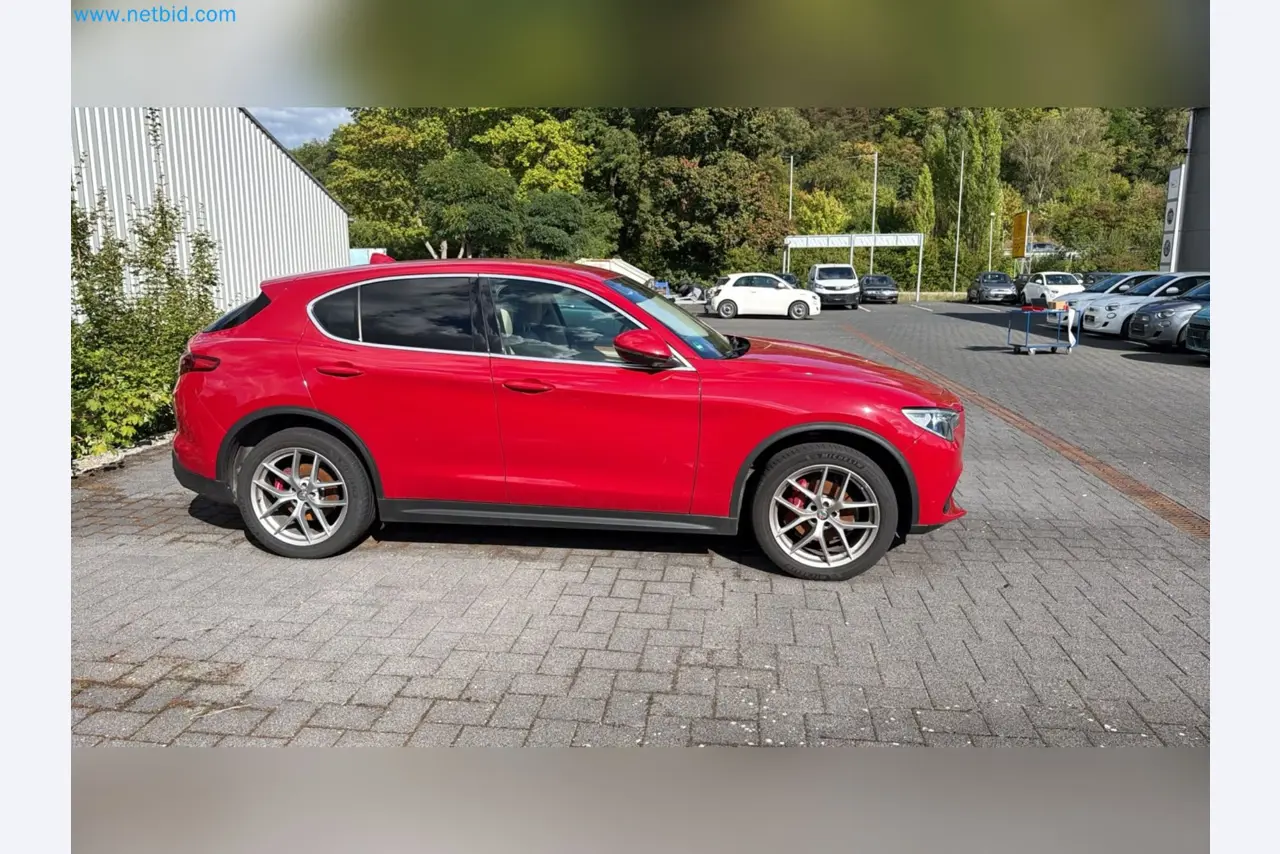 Passenger cars, electric cars, and automotive repair shop equipment at a Fiat dealership-7