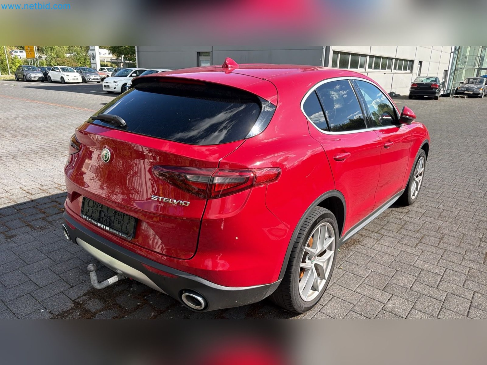 Passenger cars, electric cars, and automotive repair shop equipment at a Fiat dealership-8