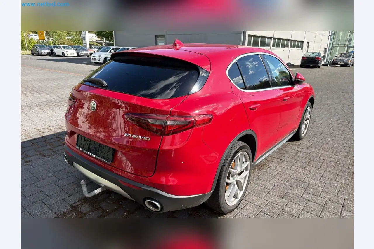 Passenger cars, electric cars, and automotive repair shop equipment at a Fiat dealership-8