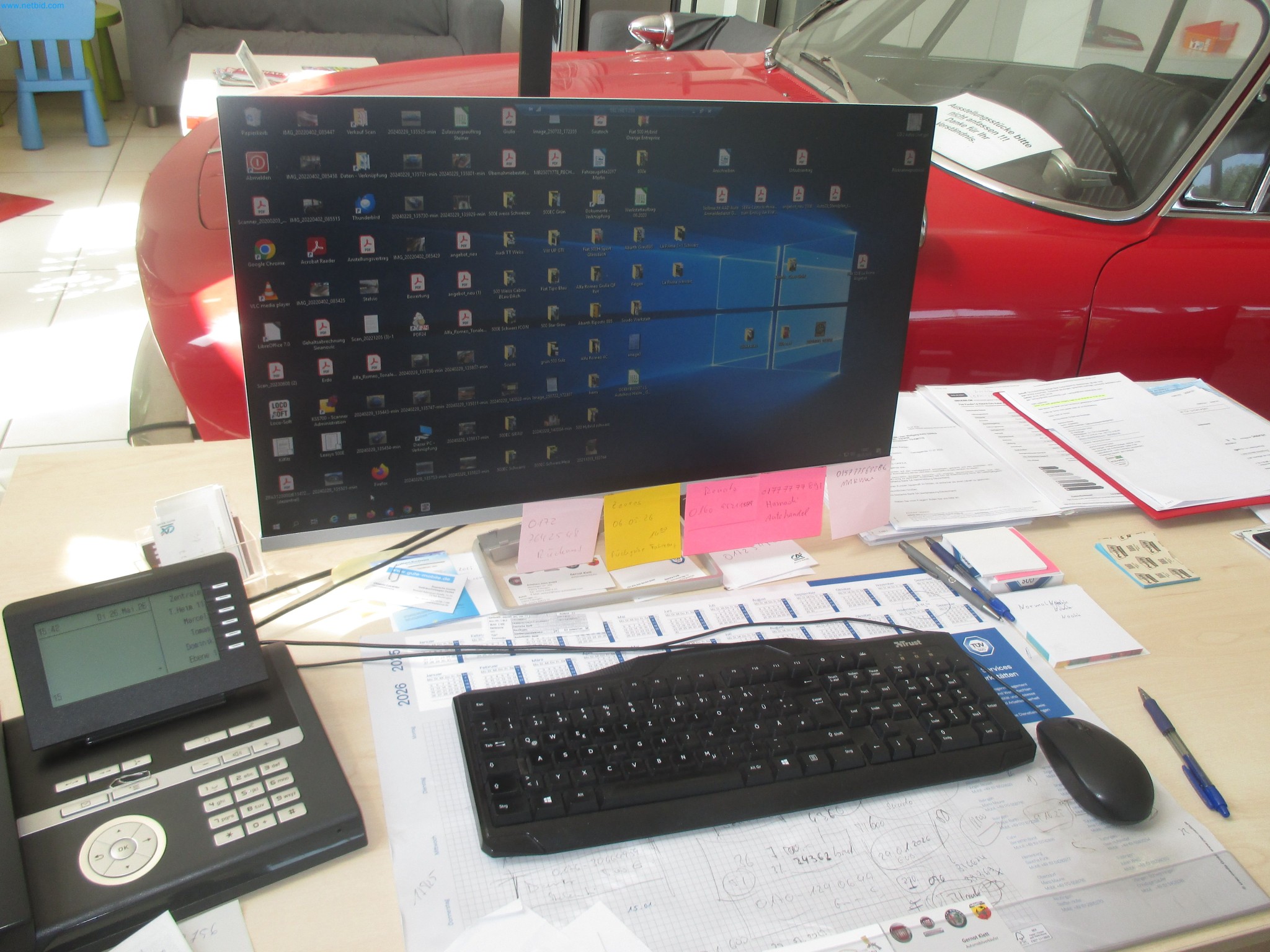 Passenger cars, electric cars, and automotive repair shop equipment at a Fiat dealership-1