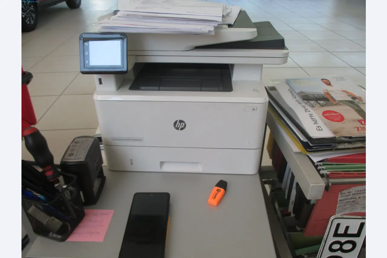 Passenger cars, electric cars, and automotive repair shop equipment at a Fiat dealership-3