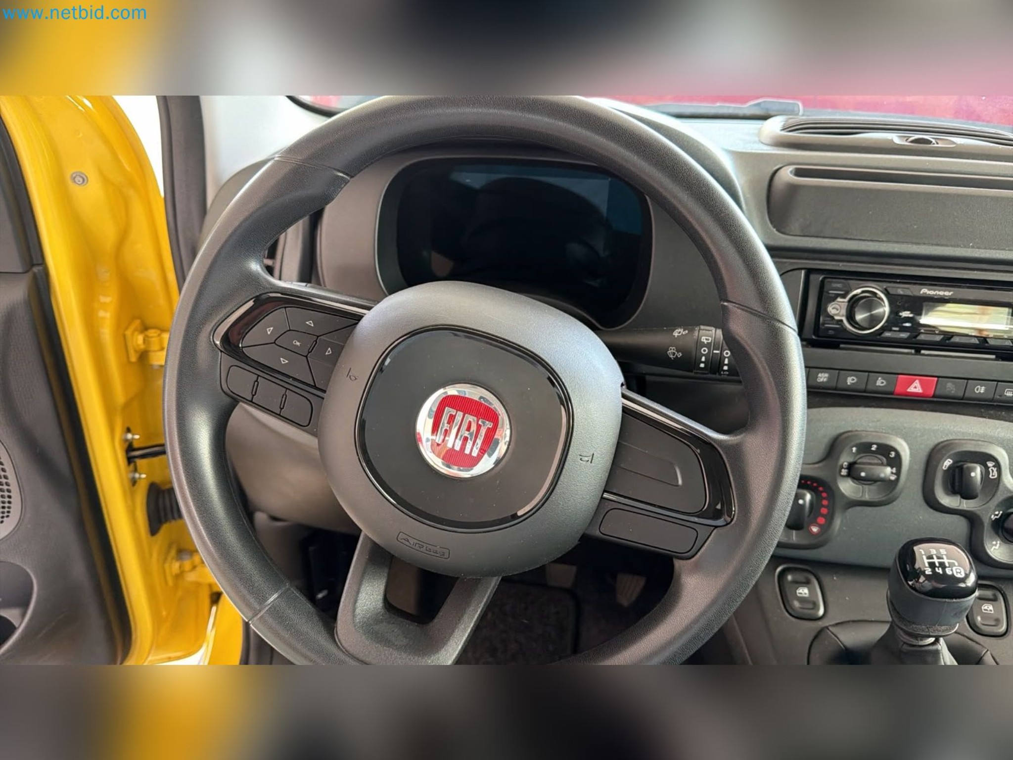 Passenger cars, electric cars, and automotive repair shop equipment at a Fiat dealership-10