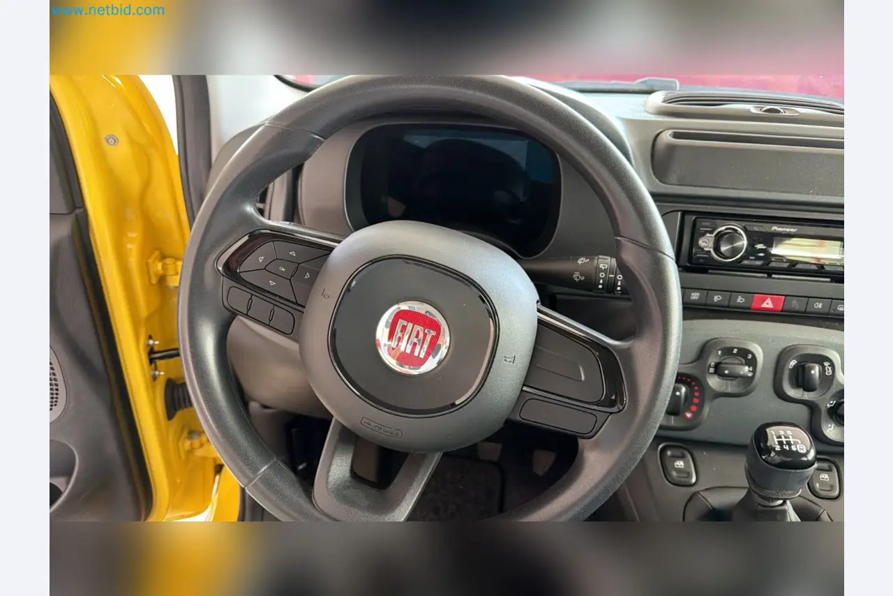 Passenger cars, electric cars, and automotive repair shop equipment at a Fiat dealership-10