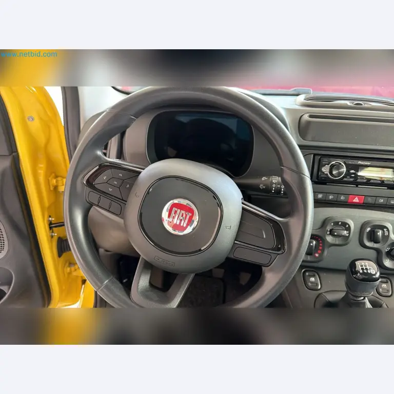 Passenger cars, electric cars, and automotive repair shop equipment at a Fiat dealership-10