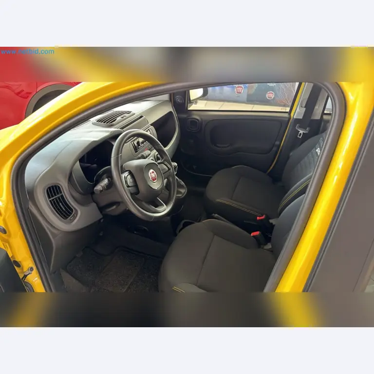 Passenger cars, electric cars, and automotive repair shop equipment at a Fiat dealership-2
