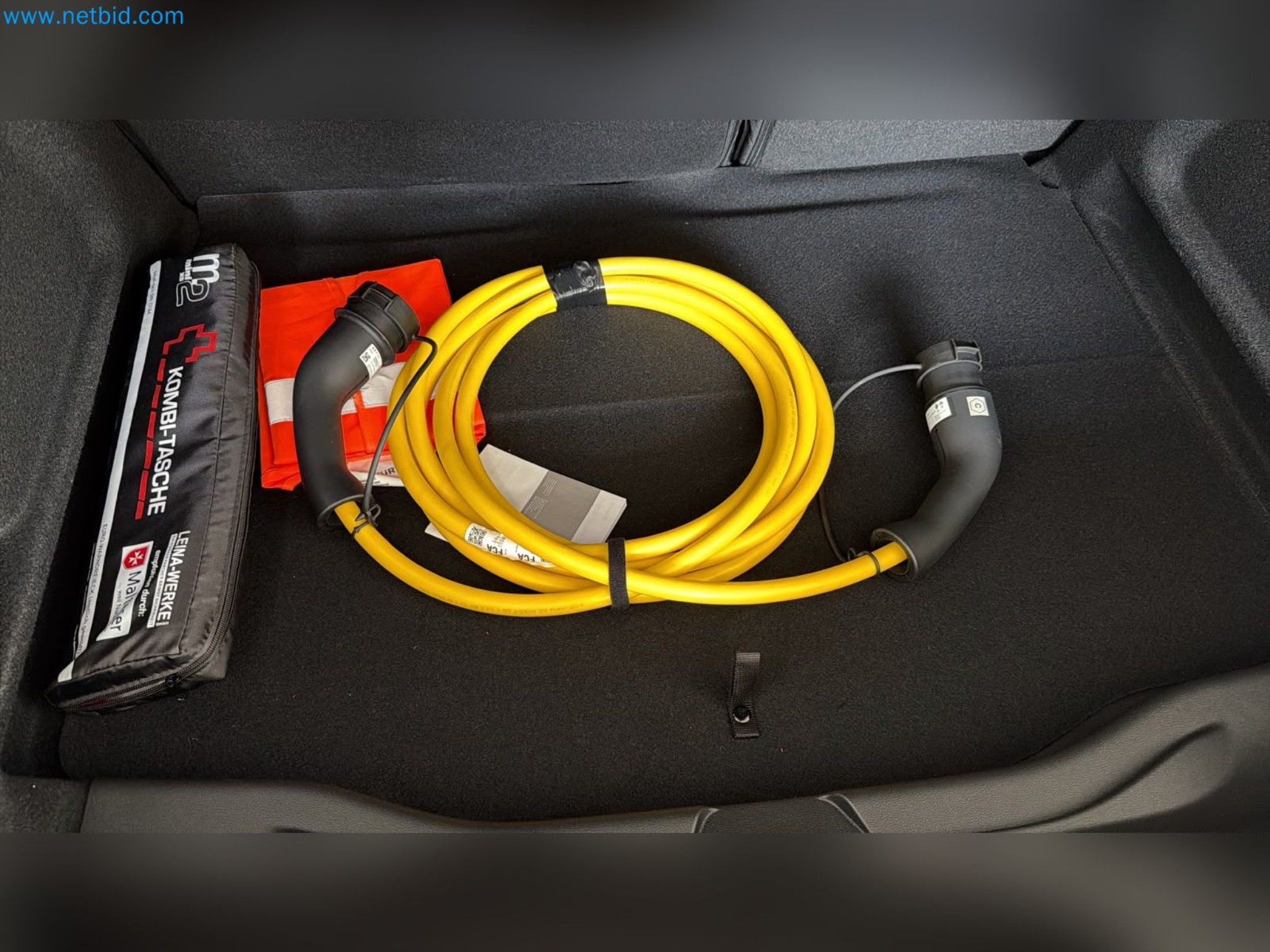 Passenger cars, electric cars, and automotive repair shop equipment at a Fiat dealership-4
