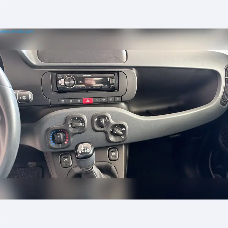 Passenger cars, electric cars, and automotive repair shop equipment at a Fiat dealership-5