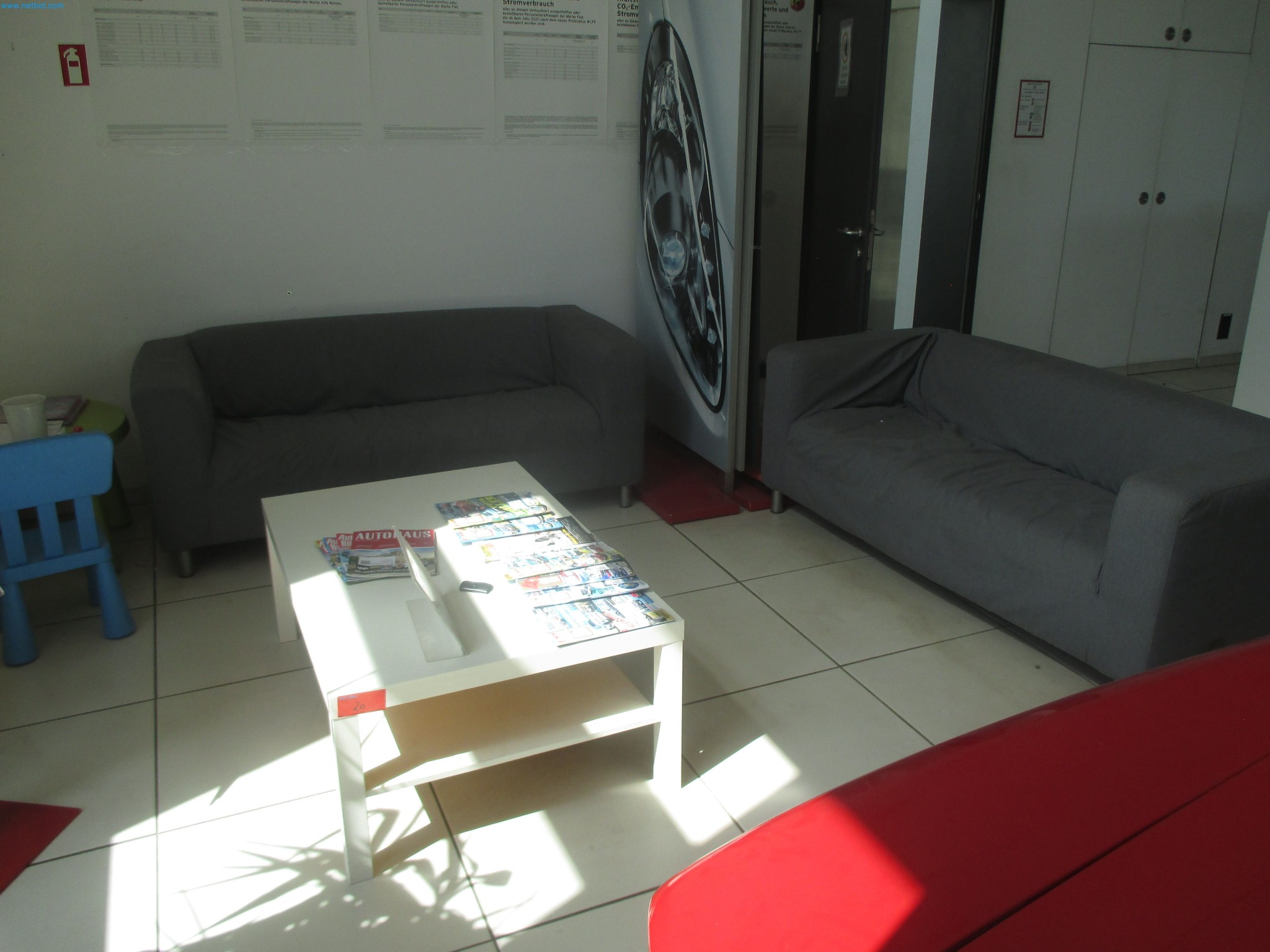 Passenger cars, electric cars, and automotive repair shop equipment at a Fiat dealership-2