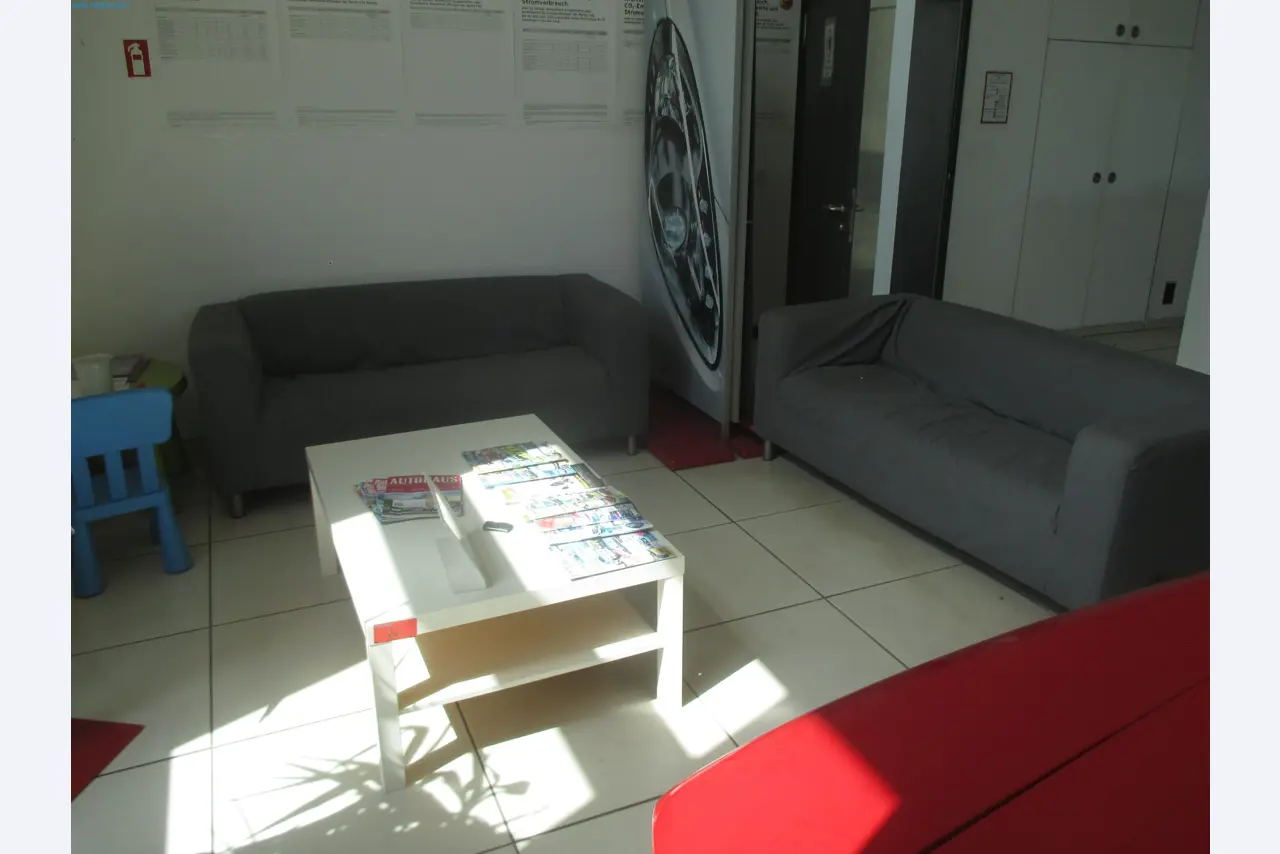 Passenger cars, electric cars, and automotive repair shop equipment at a Fiat dealership-2