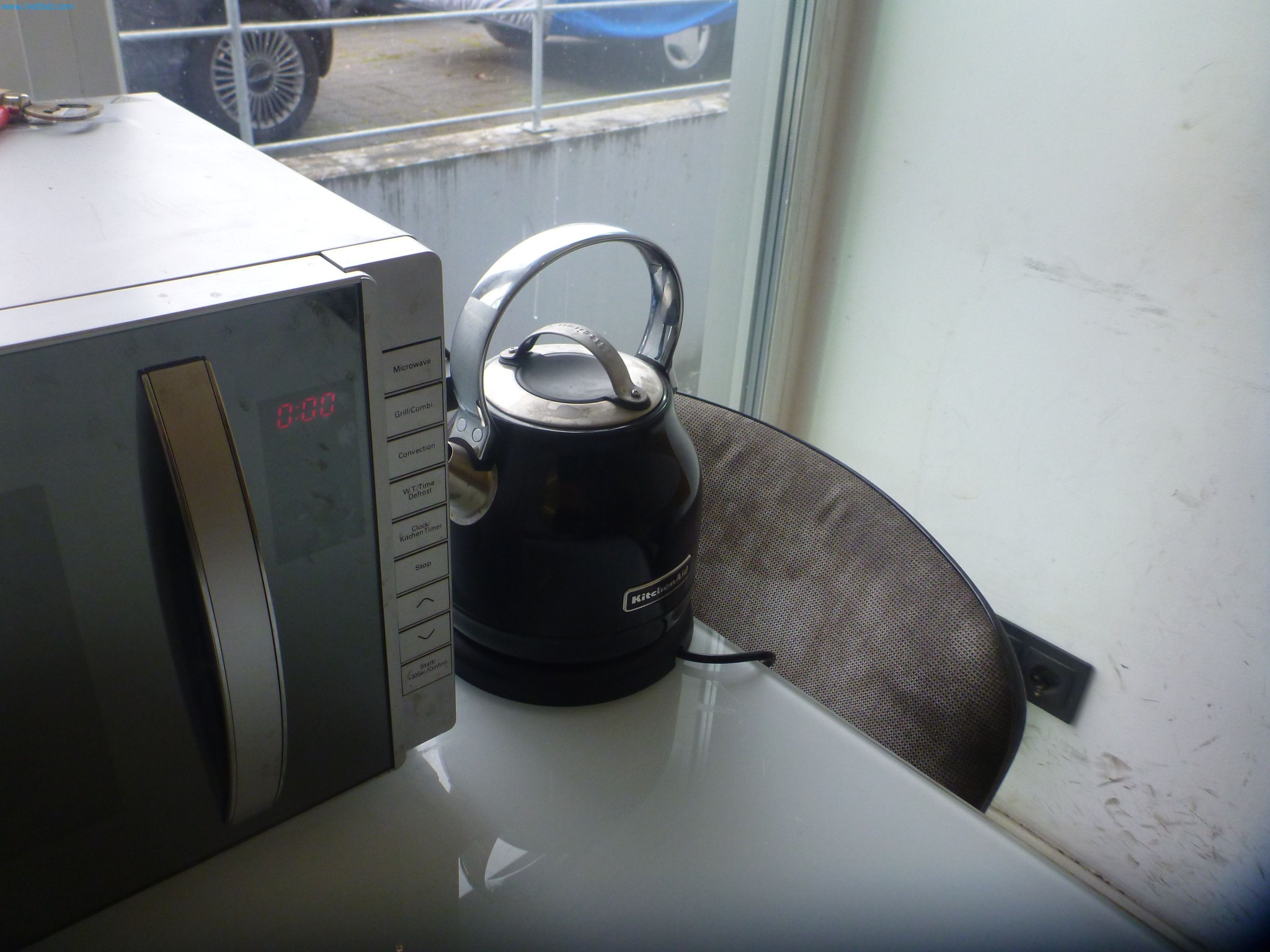 Passenger cars, electric cars, and automotive repair shop equipment at a Fiat dealership-7