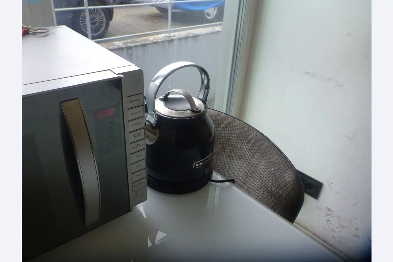 Passenger cars, electric cars, and automotive repair shop equipment at a Fiat dealership-7