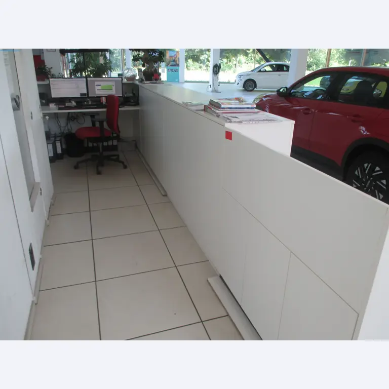 Passenger cars, electric cars, and automotive repair shop equipment at a Fiat dealership-2