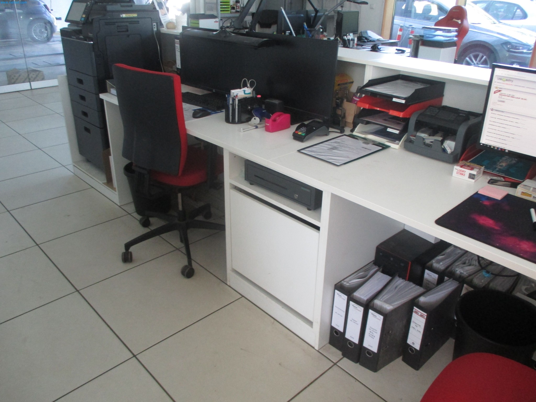 Passenger cars, electric cars, and automotive repair shop equipment at a Fiat dealership-4