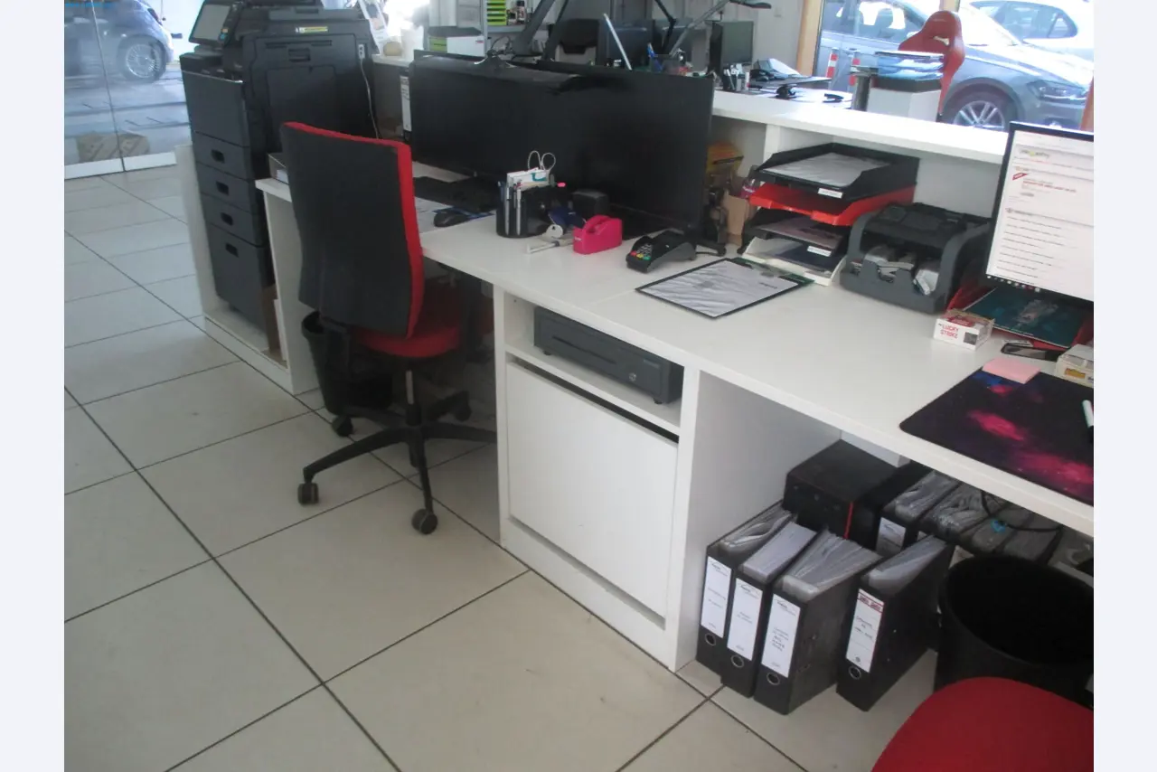 Passenger cars, electric cars, and automotive repair shop equipment at a Fiat dealership-4