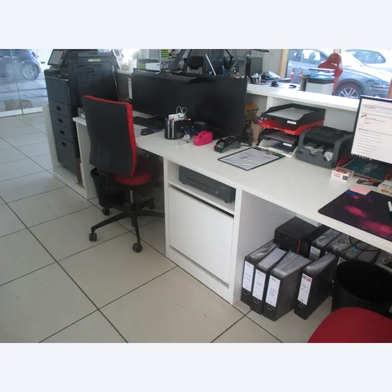 Passenger cars, electric cars, and automotive repair shop equipment at a Fiat dealership-4