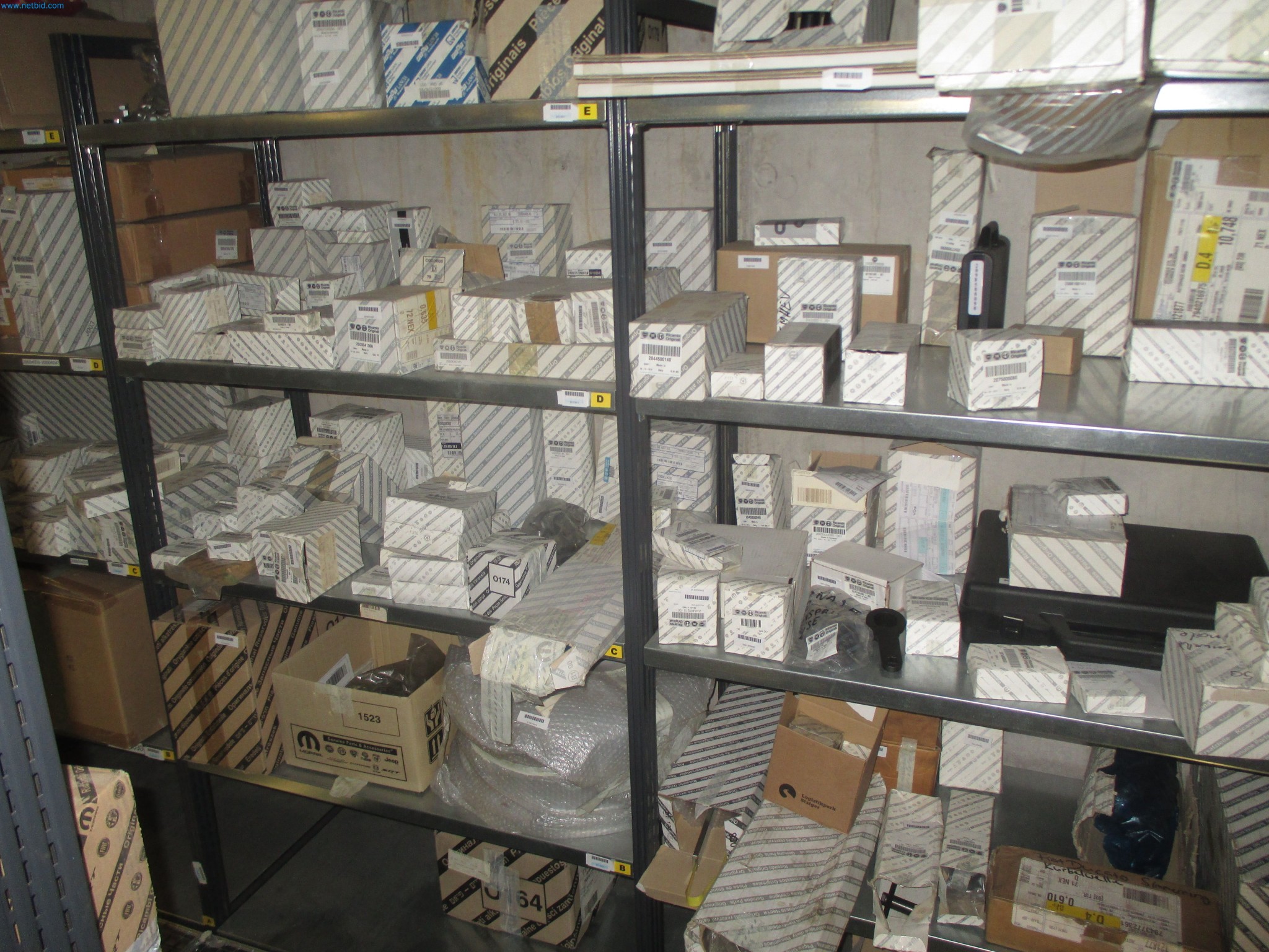Passenger cars, electric cars, and automotive repair shop equipment at a Fiat dealership-2