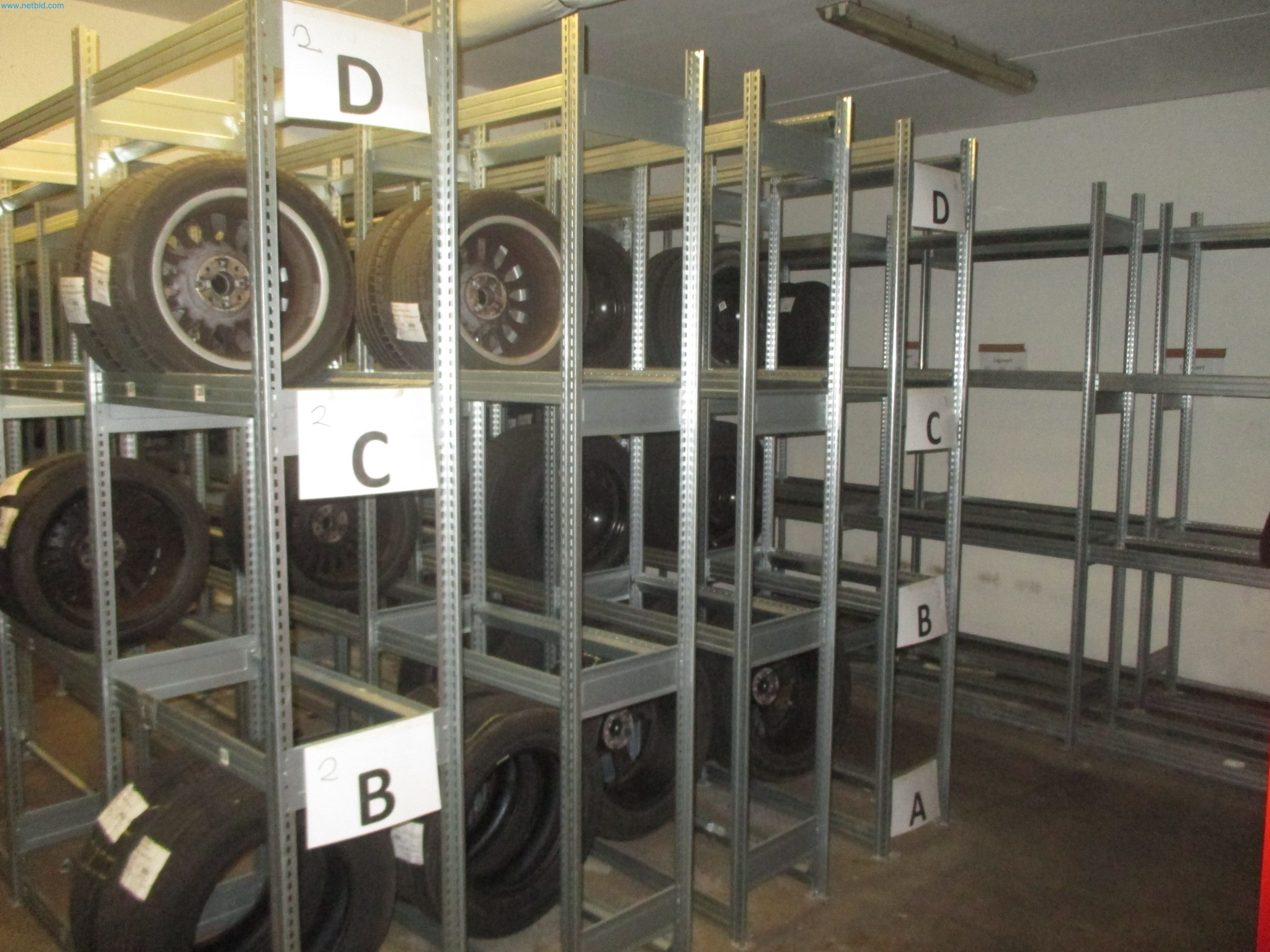 Passenger cars, electric cars, and automotive repair shop equipment at a Fiat dealership-2