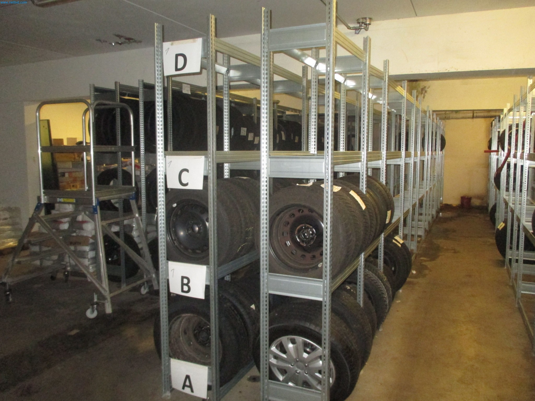 Passenger cars, electric cars, and automotive repair shop equipment at a Fiat dealership-3