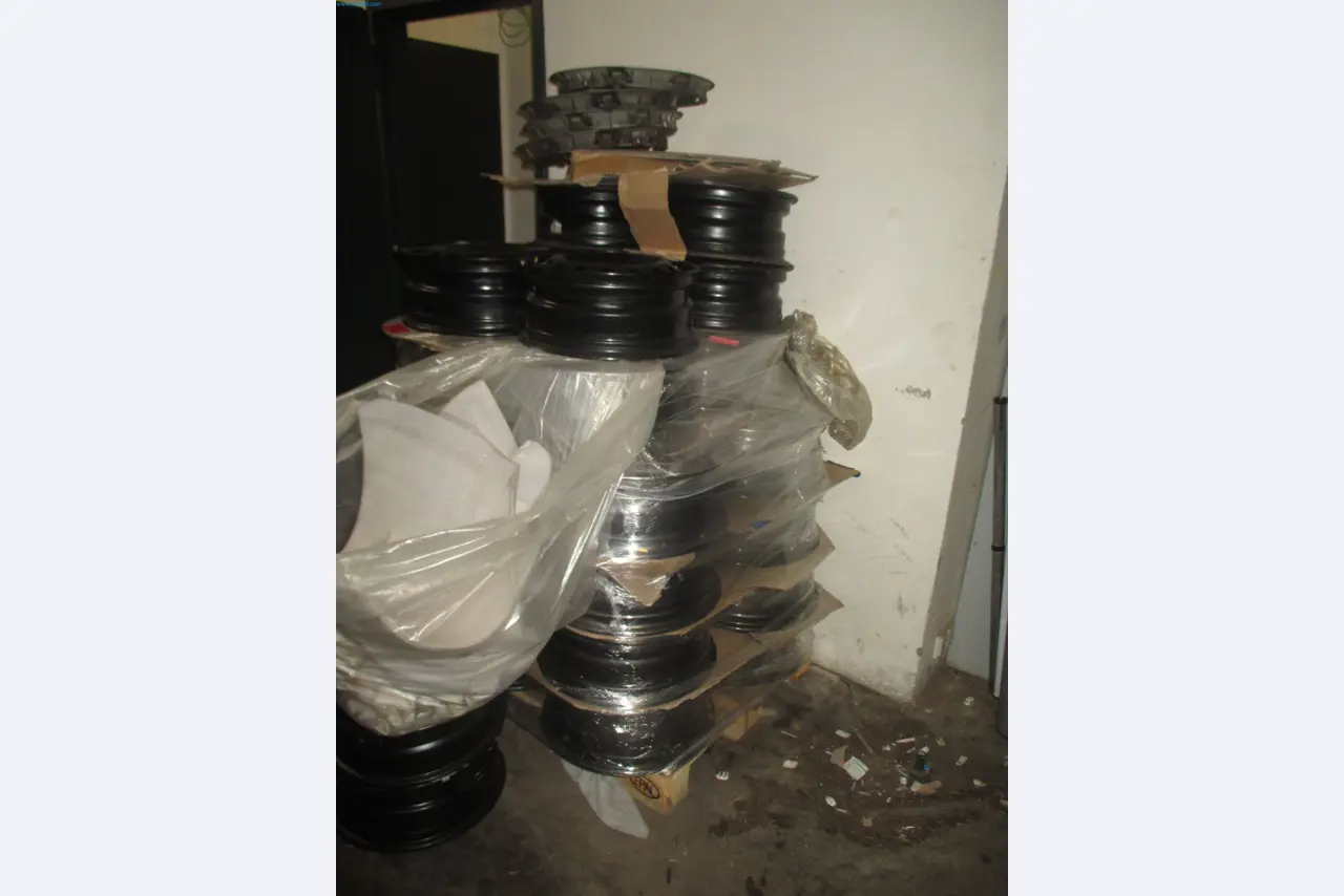 Passenger cars, electric cars, and automotive repair shop equipment at a Fiat dealership-2