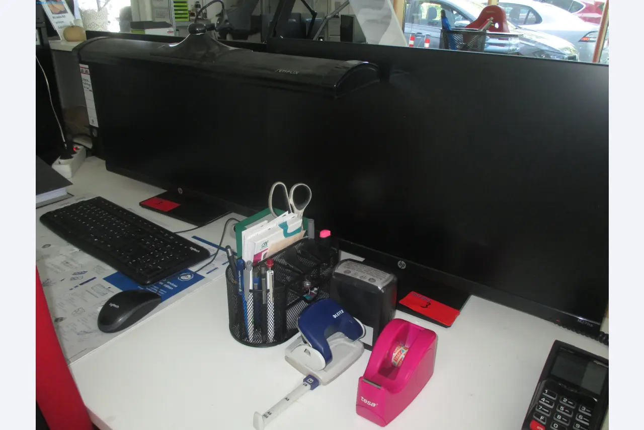 Passenger cars, electric cars, and automotive repair shop equipment at a Fiat dealership-1