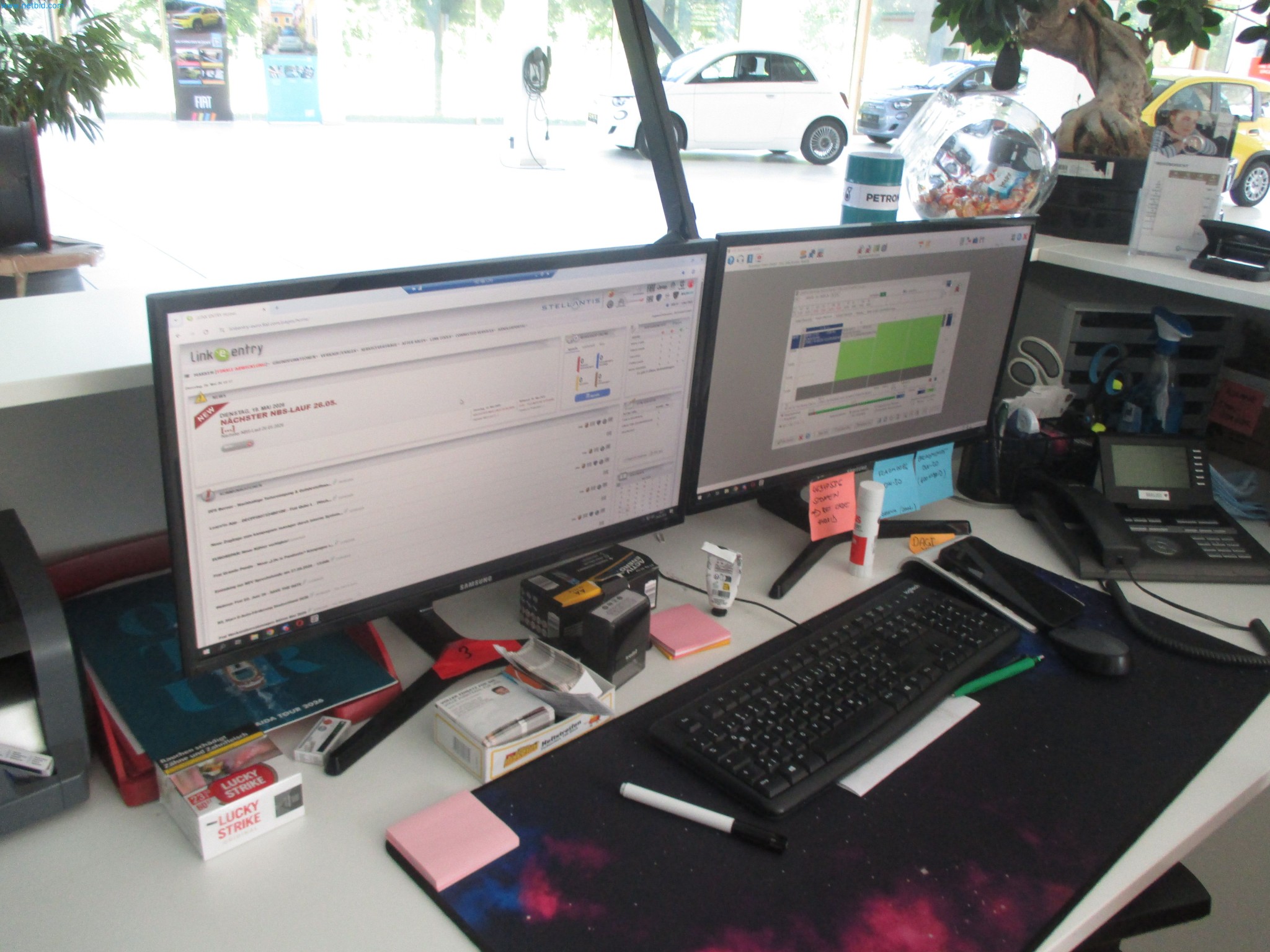 Passenger cars, electric cars, and automotive repair shop equipment at a Fiat dealership-3