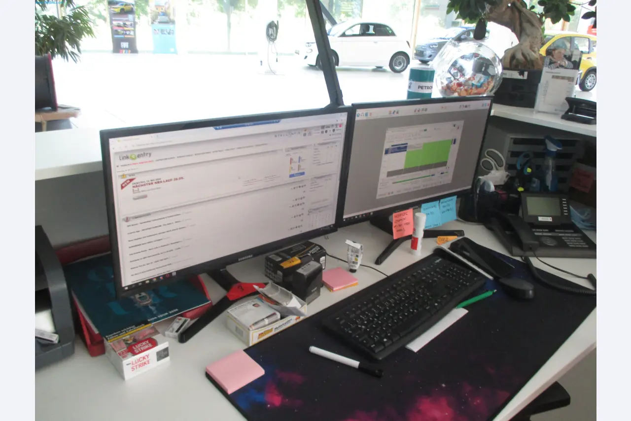Passenger cars, electric cars, and automotive repair shop equipment at a Fiat dealership-3