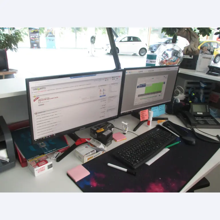 Passenger cars, electric cars, and automotive repair shop equipment at a Fiat dealership-3