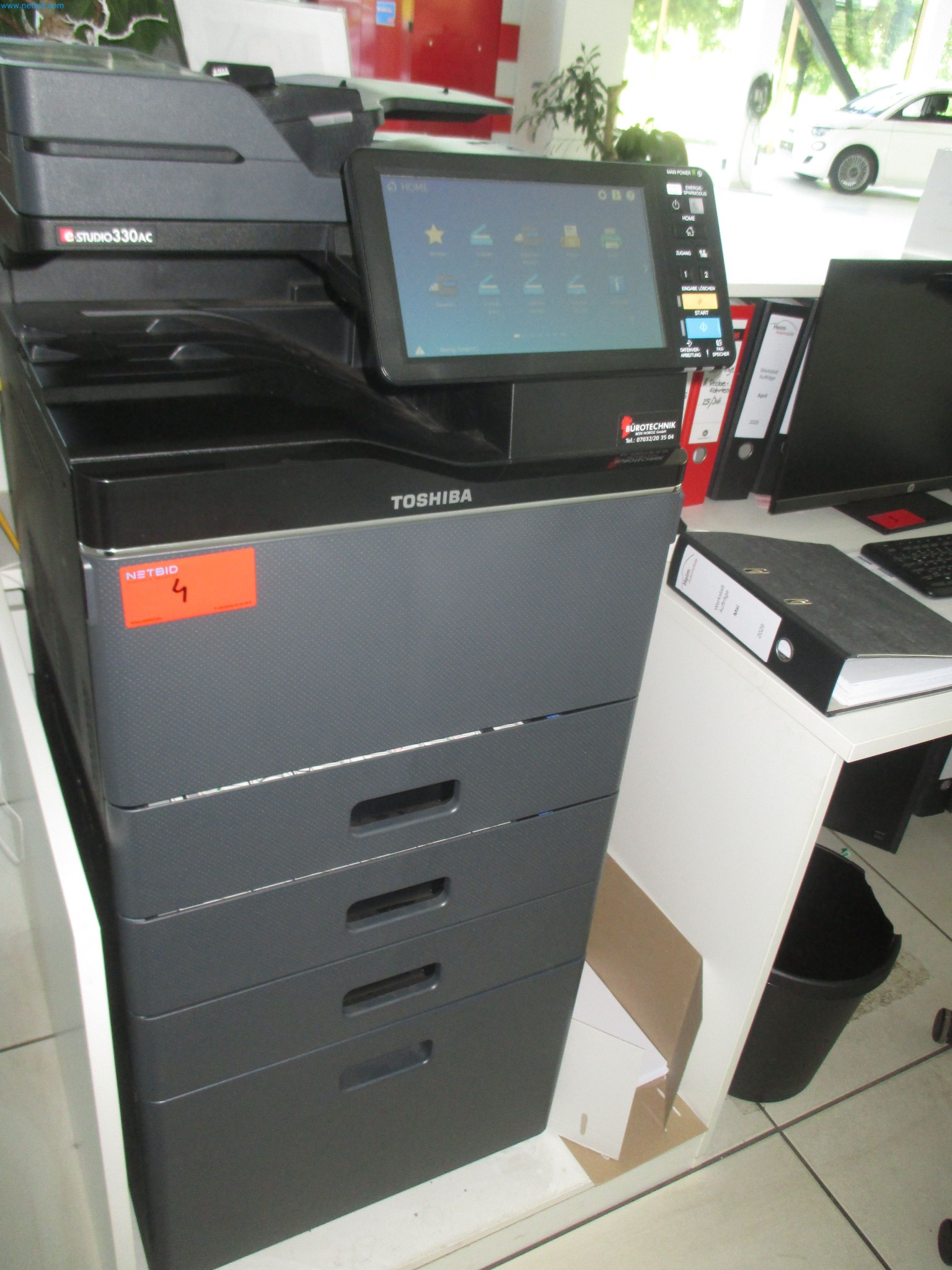 Passenger cars, electric cars, and automotive repair shop equipment at a Fiat dealership-1