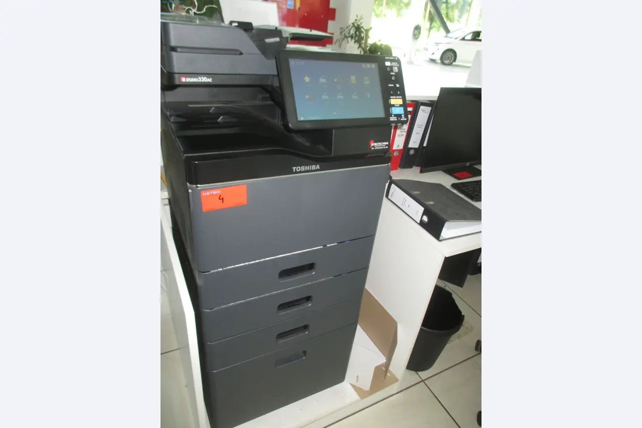 Passenger cars, electric cars, and automotive repair shop equipment at a Fiat dealership-1