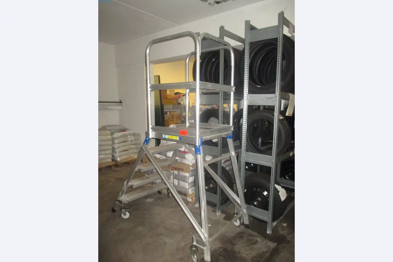 Passenger cars, electric cars, and automotive repair shop equipment at a Fiat dealership-1