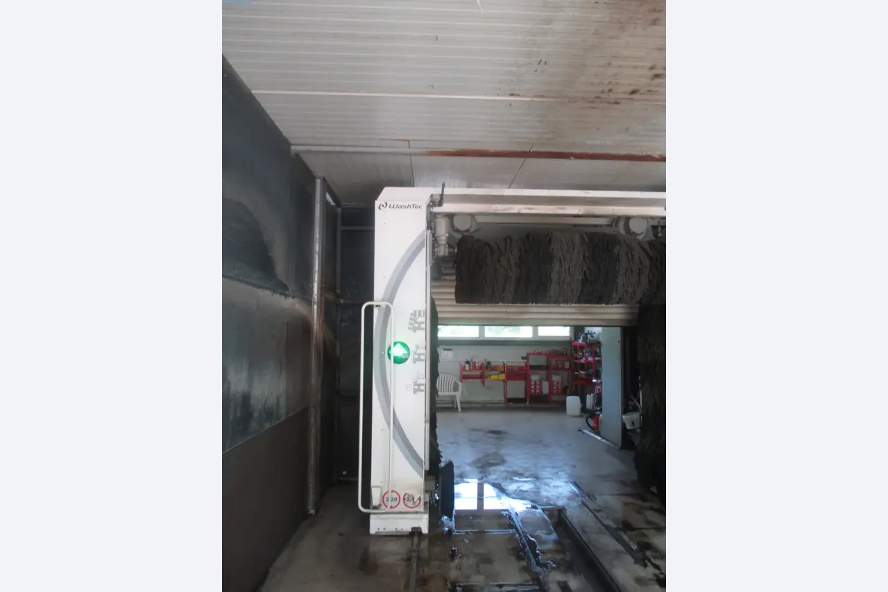 Passenger cars, electric cars, and automotive repair shop equipment at a Fiat dealership-2