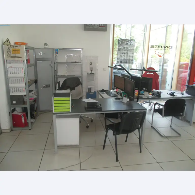 Passenger cars, electric cars, and automotive repair shop equipment at a Fiat dealership-1