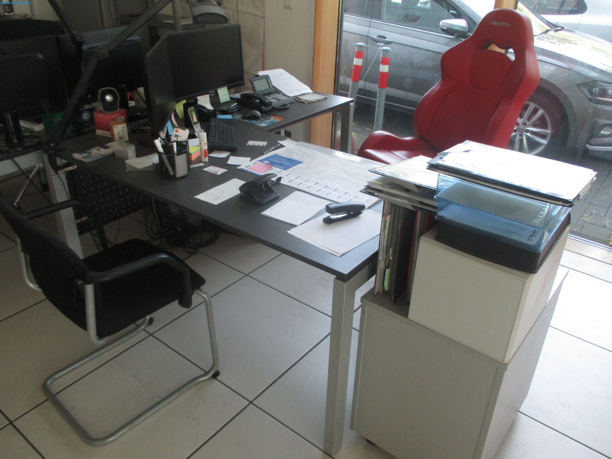 Passenger cars, electric cars, and automotive repair shop equipment at a Fiat dealership-2