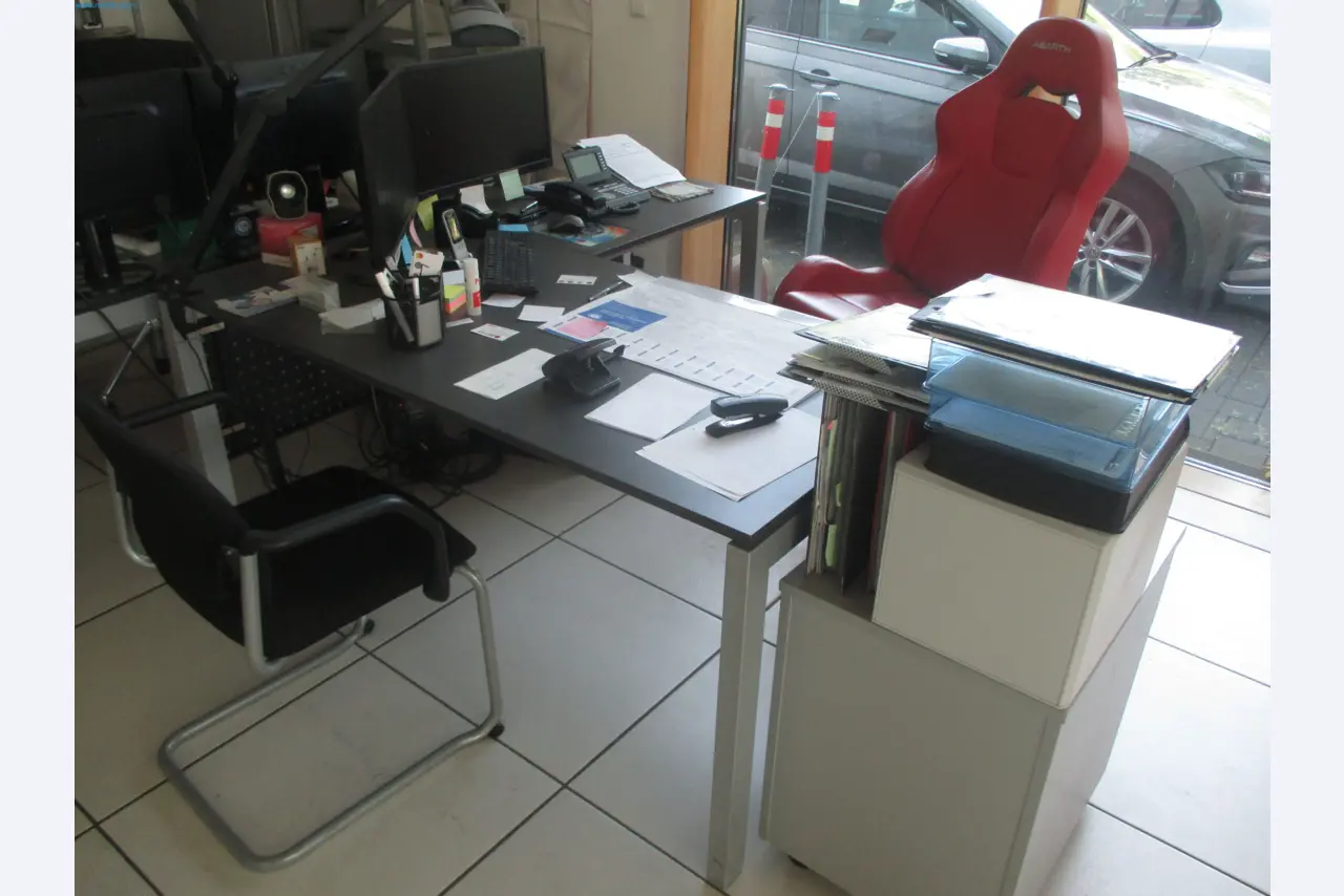 Passenger cars, electric cars, and automotive repair shop equipment at a Fiat dealership-2