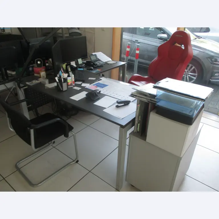 Passenger cars, electric cars, and automotive repair shop equipment at a Fiat dealership-2