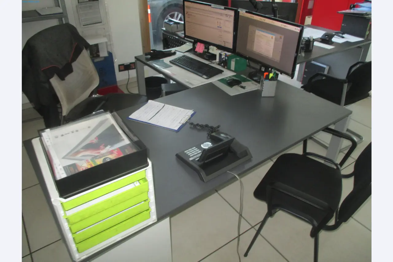 Passenger cars, electric cars, and automotive repair shop equipment at a Fiat dealership-3
