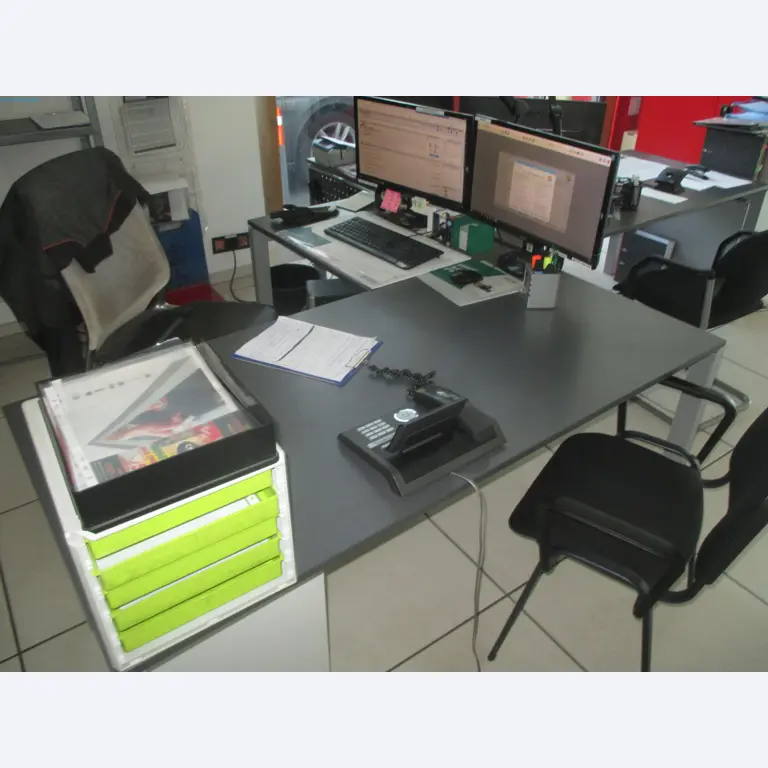 Passenger cars, electric cars, and automotive repair shop equipment at a Fiat dealership-3