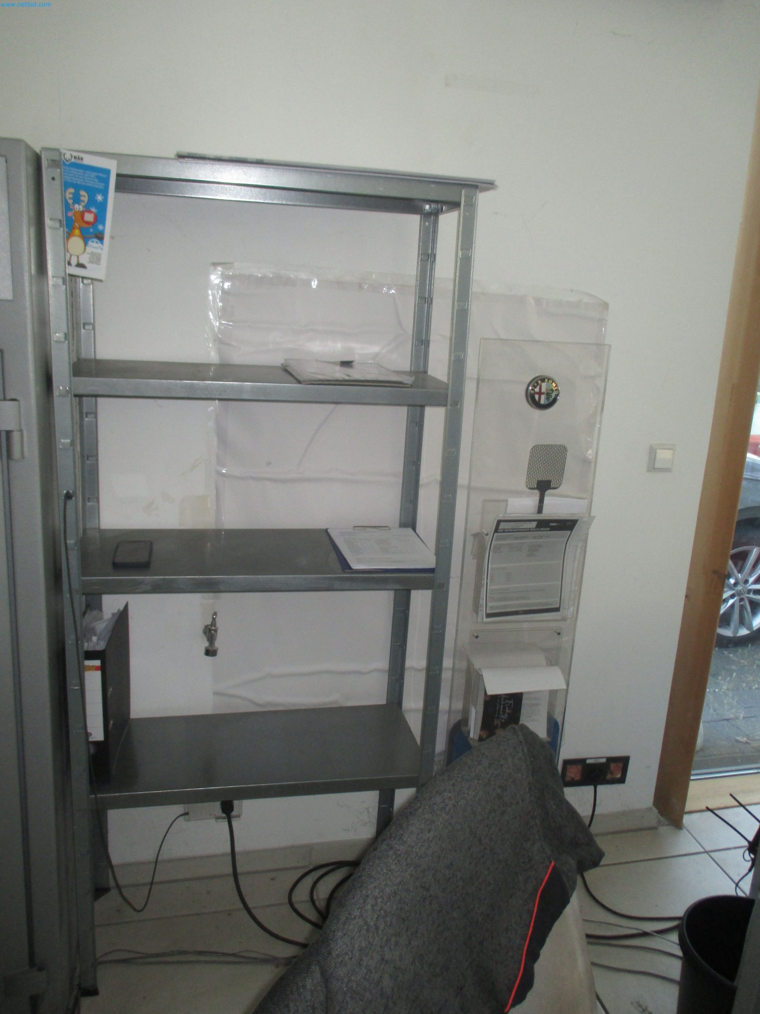 Passenger cars, electric cars, and automotive repair shop equipment at a Fiat dealership-4