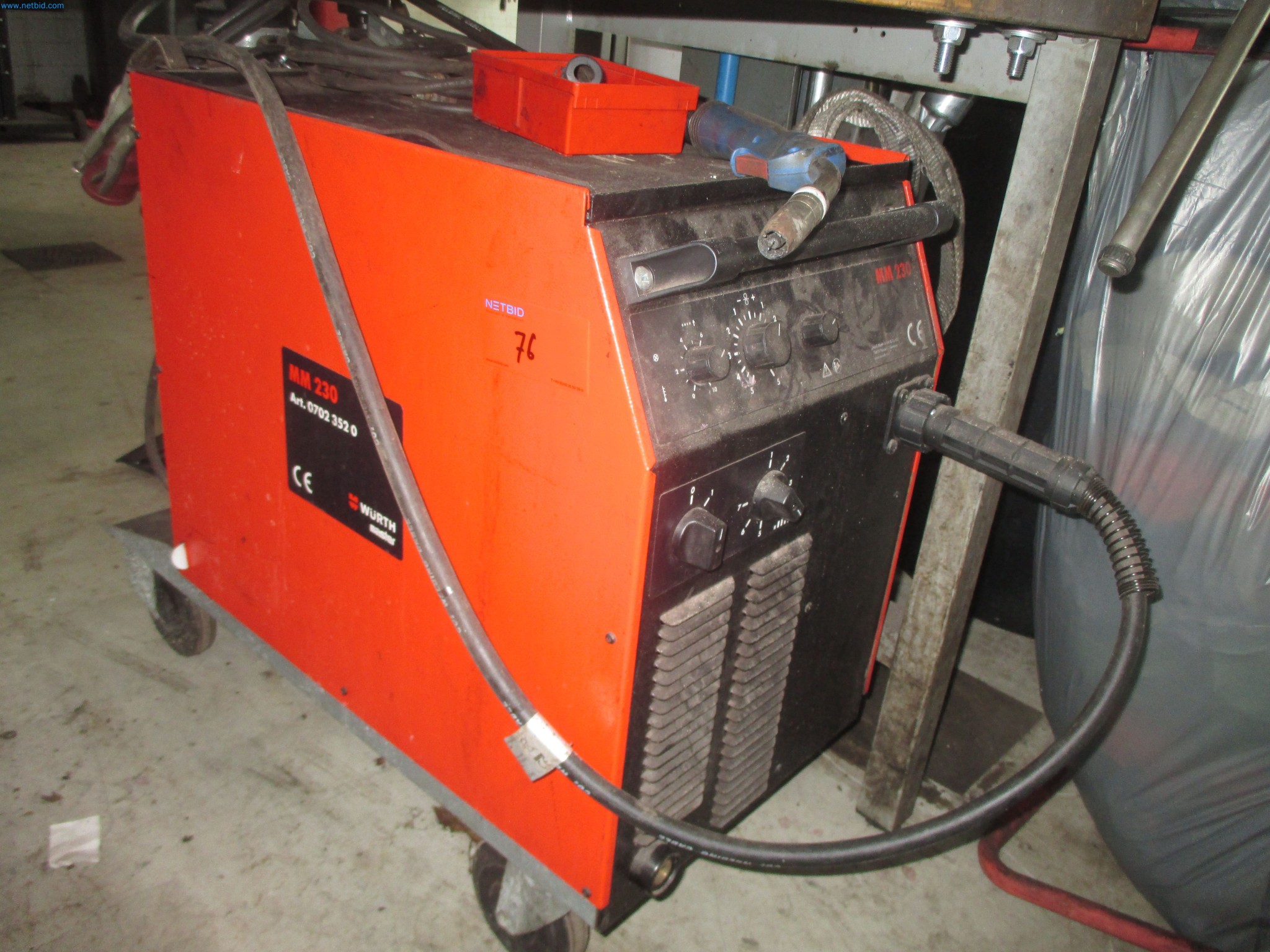 Passenger cars, electric cars, and automotive repair shop equipment at a Fiat dealership-1