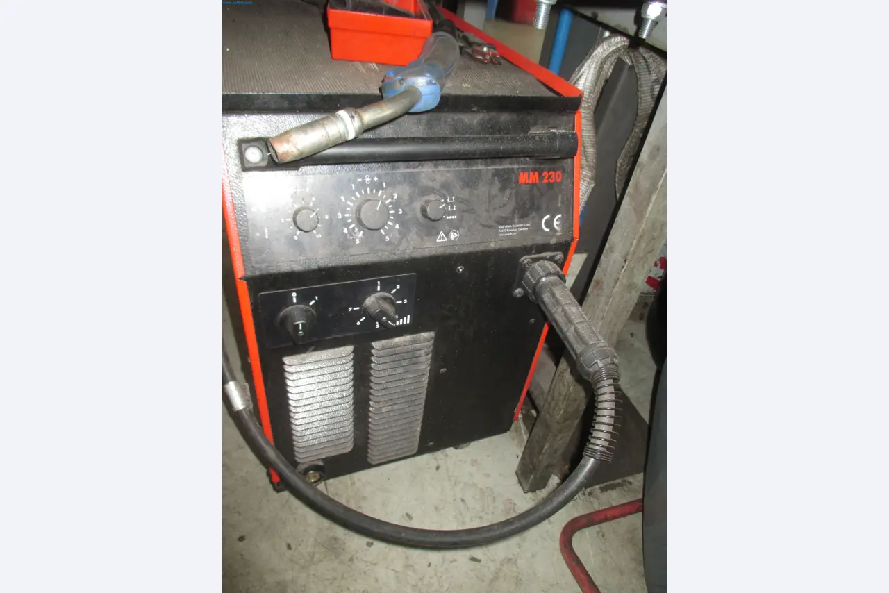 Passenger cars, electric cars, and automotive repair shop equipment at a Fiat dealership-2