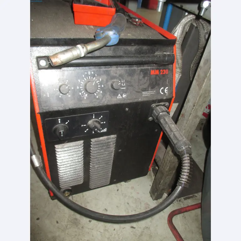 Passenger cars, electric cars, and automotive repair shop equipment at a Fiat dealership-2