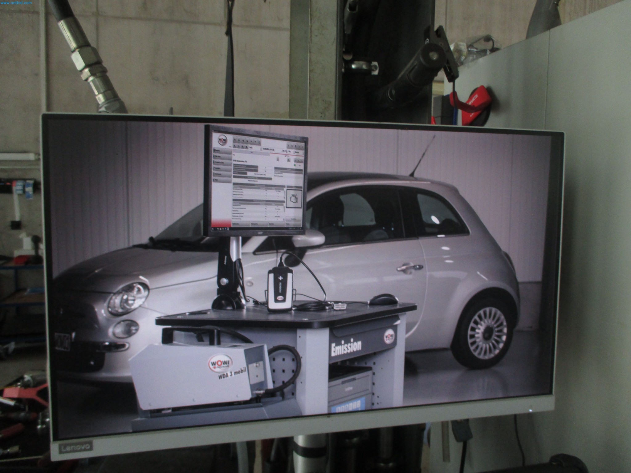 Passenger cars, electric cars, and automotive repair shop equipment at a Fiat dealership-2