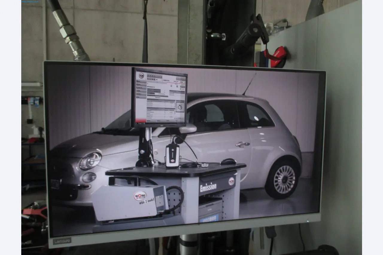 Passenger cars, electric cars, and automotive repair shop equipment at a Fiat dealership-2