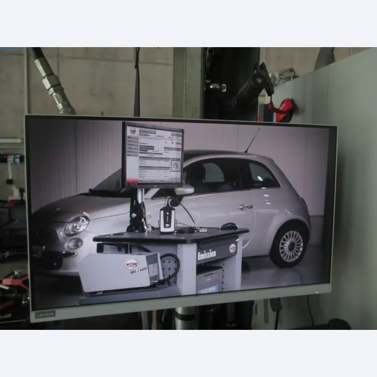 Passenger cars, electric cars, and automotive repair shop equipment at a Fiat dealership-2