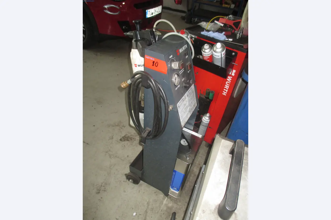 Passenger cars, electric cars, and automotive repair shop equipment at a Fiat dealership-4