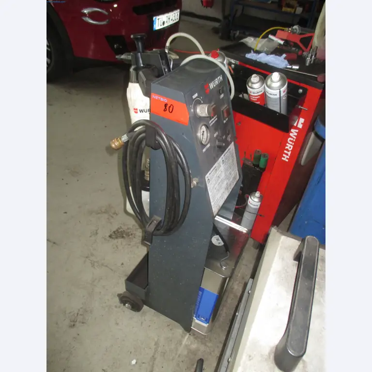 Passenger cars, electric cars, and automotive repair shop equipment at a Fiat dealership-4