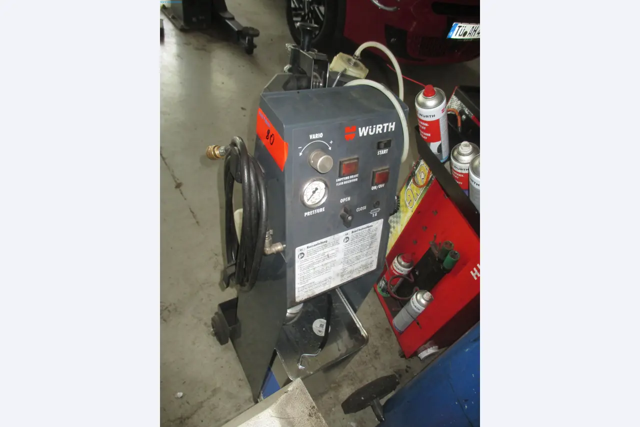 Passenger cars, electric cars, and automotive repair shop equipment at a Fiat dealership-5
